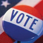 stock image of voter button on flag